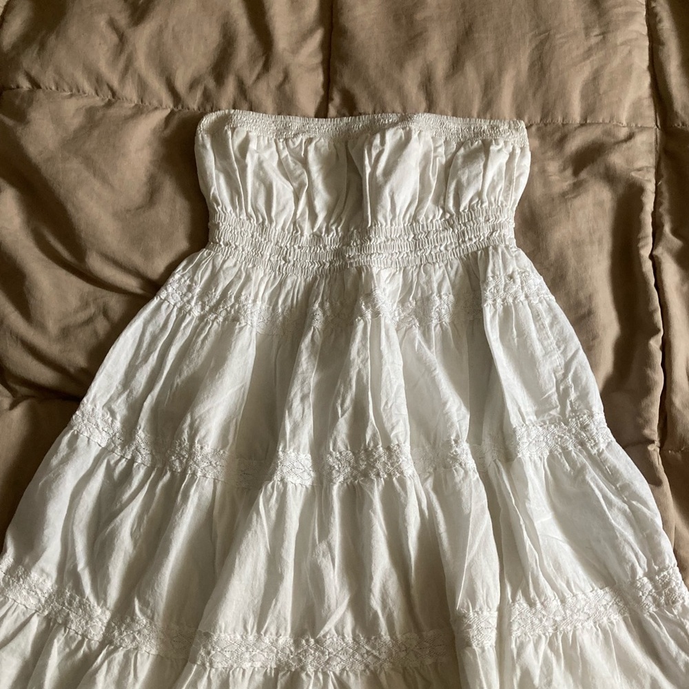 Strapless white ruffled above the knee dress